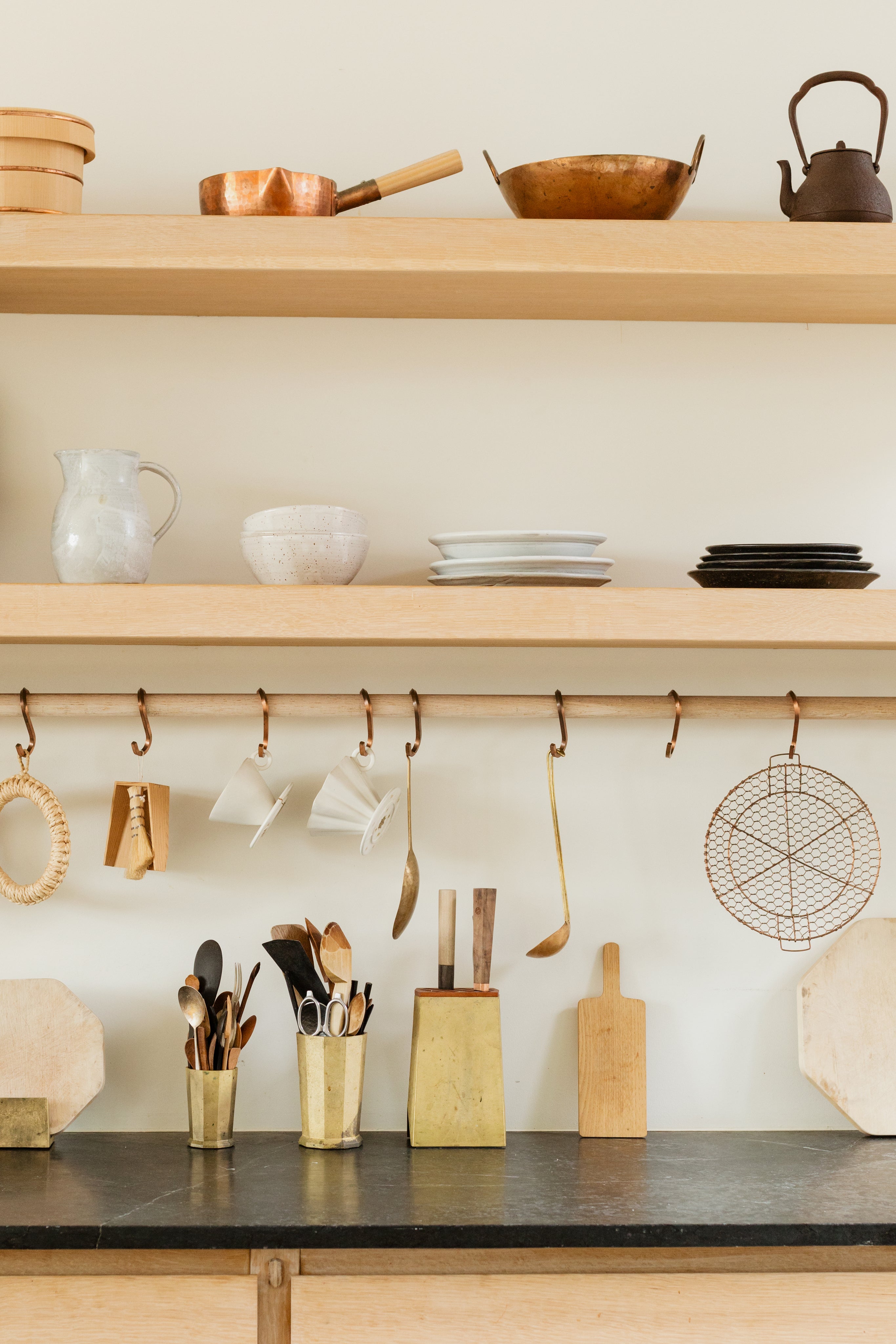 Bright modern kitchen with wood cabinetry and dining essentials